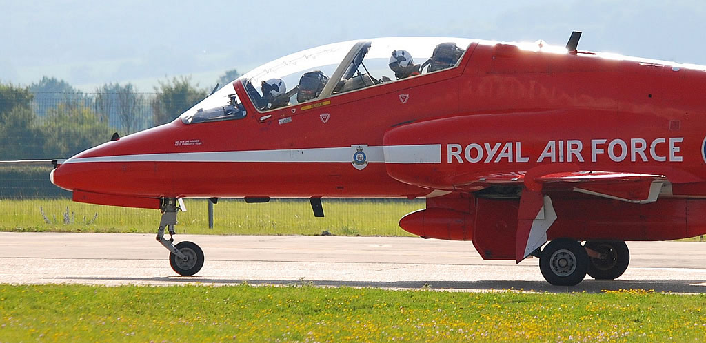 Royal Air Force Red Arrow preparing for takeoff at air show Royal Air Force Red Arrow preparing for takeoff at air show