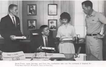 Kids take over command of England Air Force Base from Colonel Richard V. Travis on Kids Day