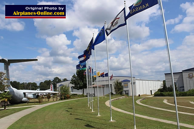 Flags in the outdoor area, with two hangars in the background at the Museum of Aviation at Robins AFB, Georgia Flags in the outdoor area, with two hangars in the background at the Museum of Aviation at Robins AFB, Georgia
